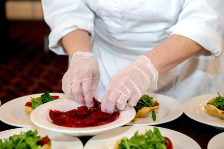Chef garnishing dish
